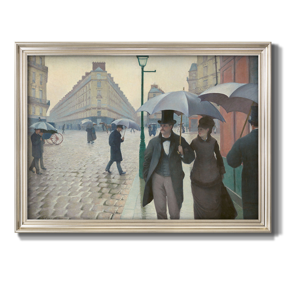 Impressionist urban street scene in the rain by Gustave Caillebotte printed on canvas in an ornate champagne frame.