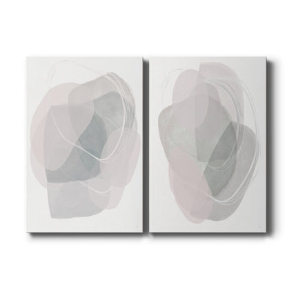 Set of two vertical canvas prints featuring soft abstract river stone artwork, displayed side by side.
