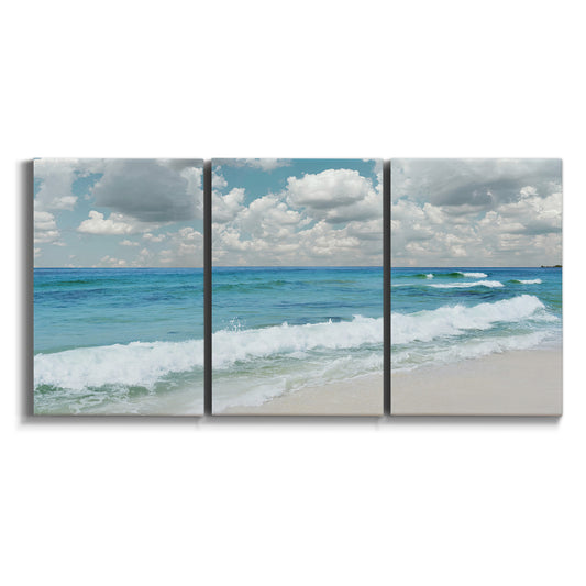Three-panel canvas wall art featuring tropical beach scene with turquoise water on white background.