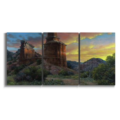 Three-panel canvas wall art featuring dramatic canyon landscape at dusk on white background.