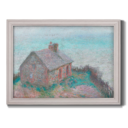 Impressionist coastal building landscape by Claude Monet printed on canvas in an ornate weathered white frame.