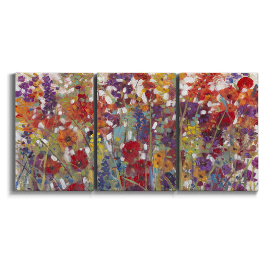 Three-panel canvas wall art featuring colorful floral arrangement on white background.
