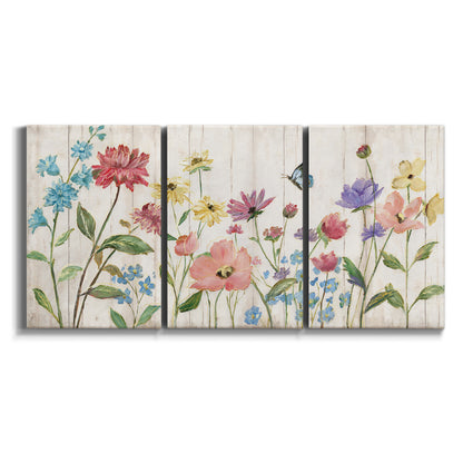 Three-panel canvas wall art featuring delicate wildflower illustration on white background.