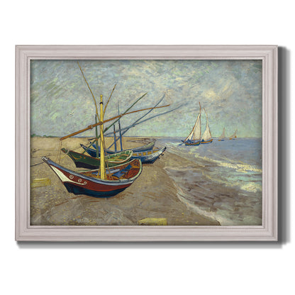 Impressionist coastal fishing boats scene by Vincent van Gogh printed on canvas in an ornate weathered white frame.