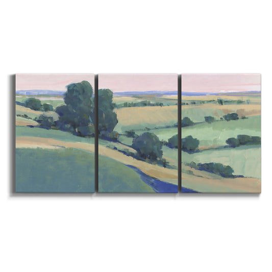 Three-panel canvas wall art featuring pastoral countryside with rocky outcrop on white background.