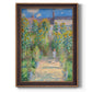 Impressionist garden landscape painting by Claude Monet printed on canvas in an ornate bronzed mahogany wood frame with a vertical orientation.