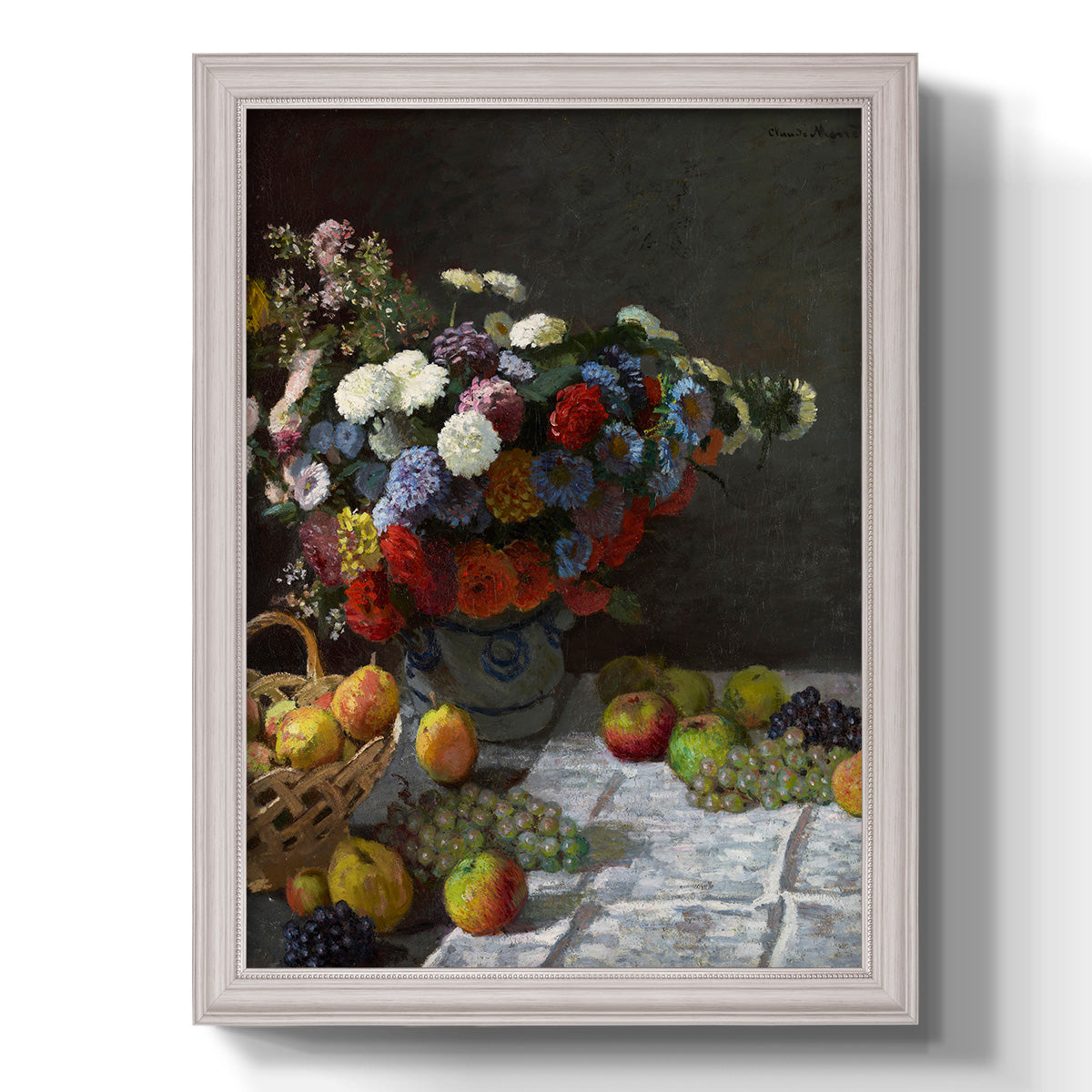 Impressionist floral still life painting by Claude Monet printed on canvas in an ornate weathered white frame with a vertical orientation.