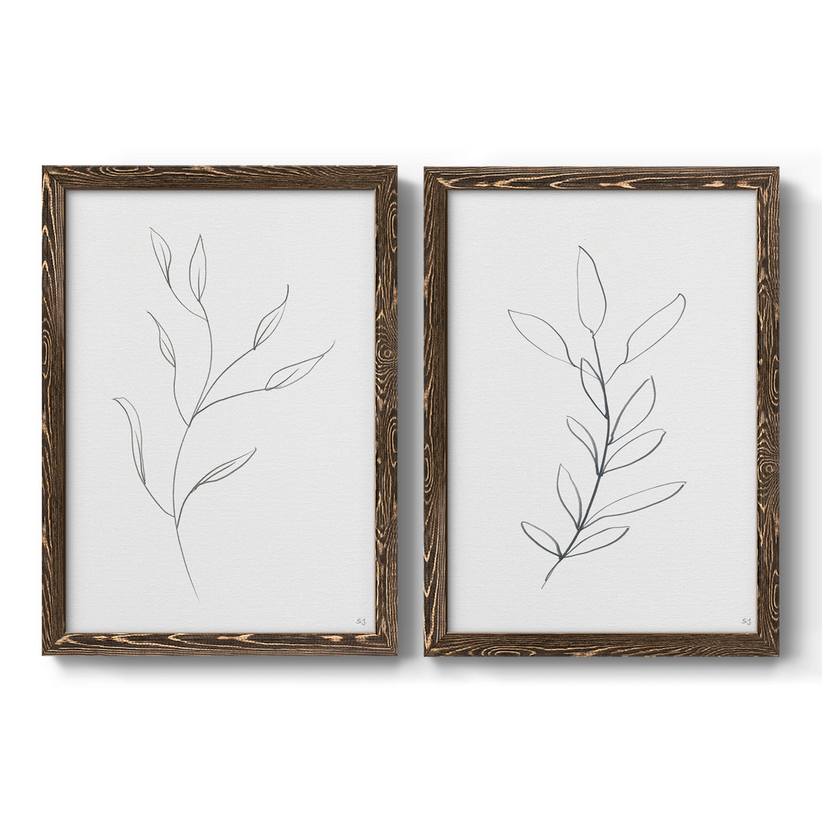 Set of two walnut barnwood framed canvas prints featuring two minimalist botanical line drawings featuring single continuous-line leafy branches.