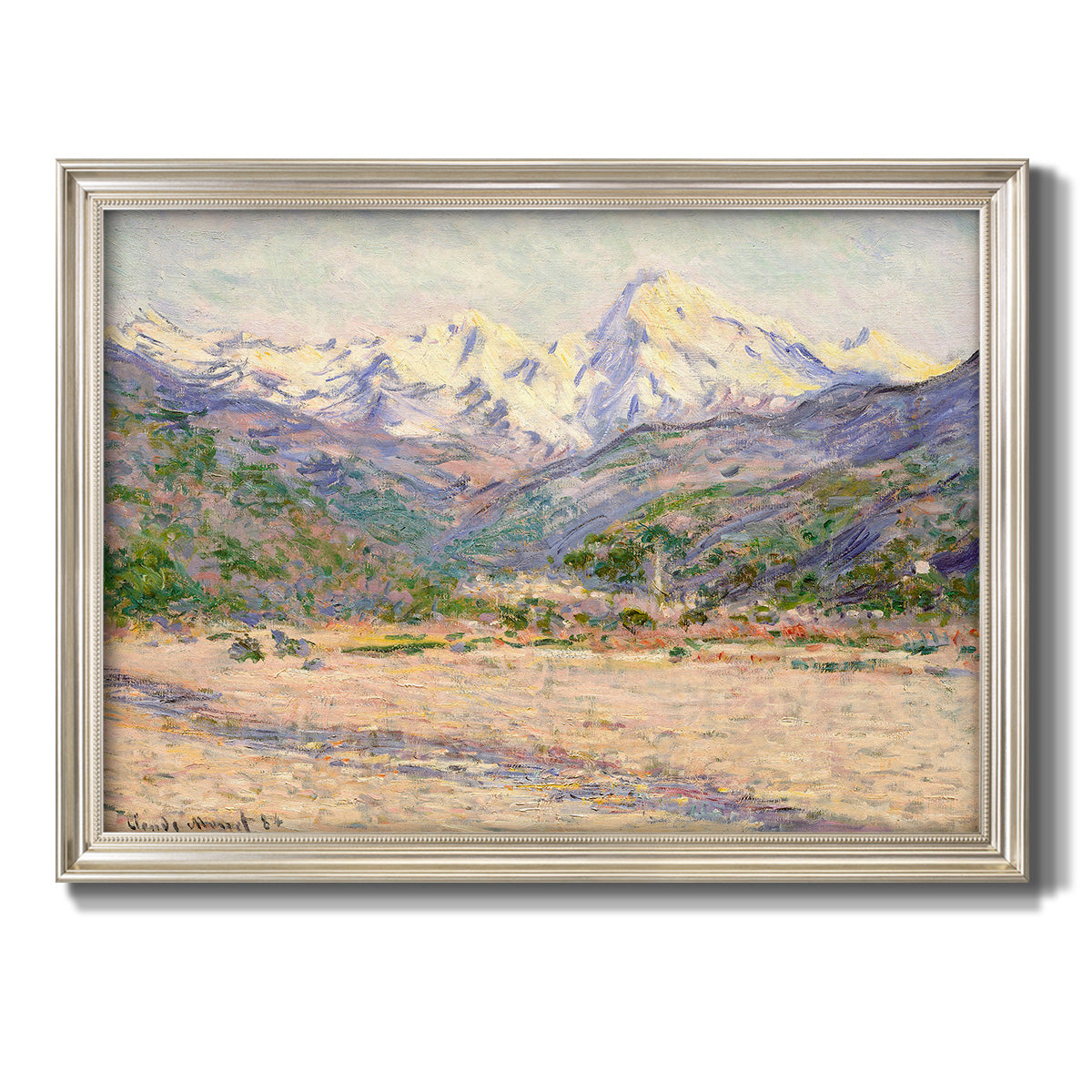 Impressionist valley landscape in southern France by Claude Monet printed on canvas in an ornate champagne frame.