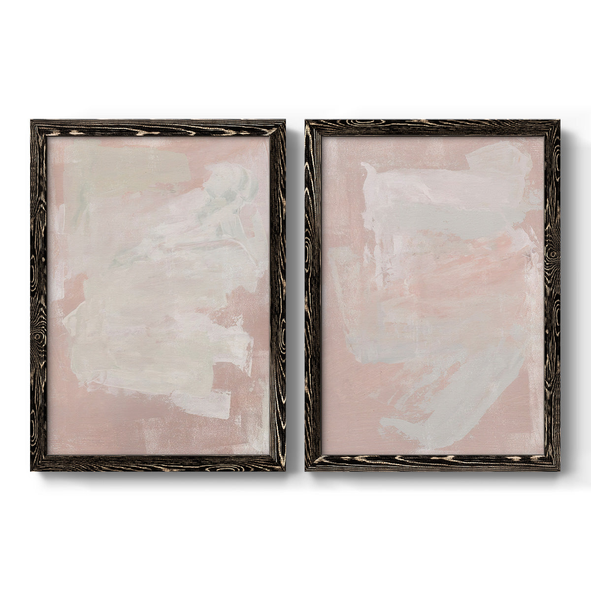 Set of two black barnwood framed canvas prints featuring two minimalist color-field abstracts featuring soft blush and white painterly fields.