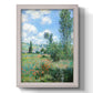 Impressionist pastoral landscape with poppy fields by Claude Monet printed on canvas in an ornate weathered white frame with a vertical orientation.