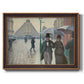 Impressionist urban street scene in the rain by Gustave Caillebotte printed on canvas in an ornate bronzed mahogany wood frame.