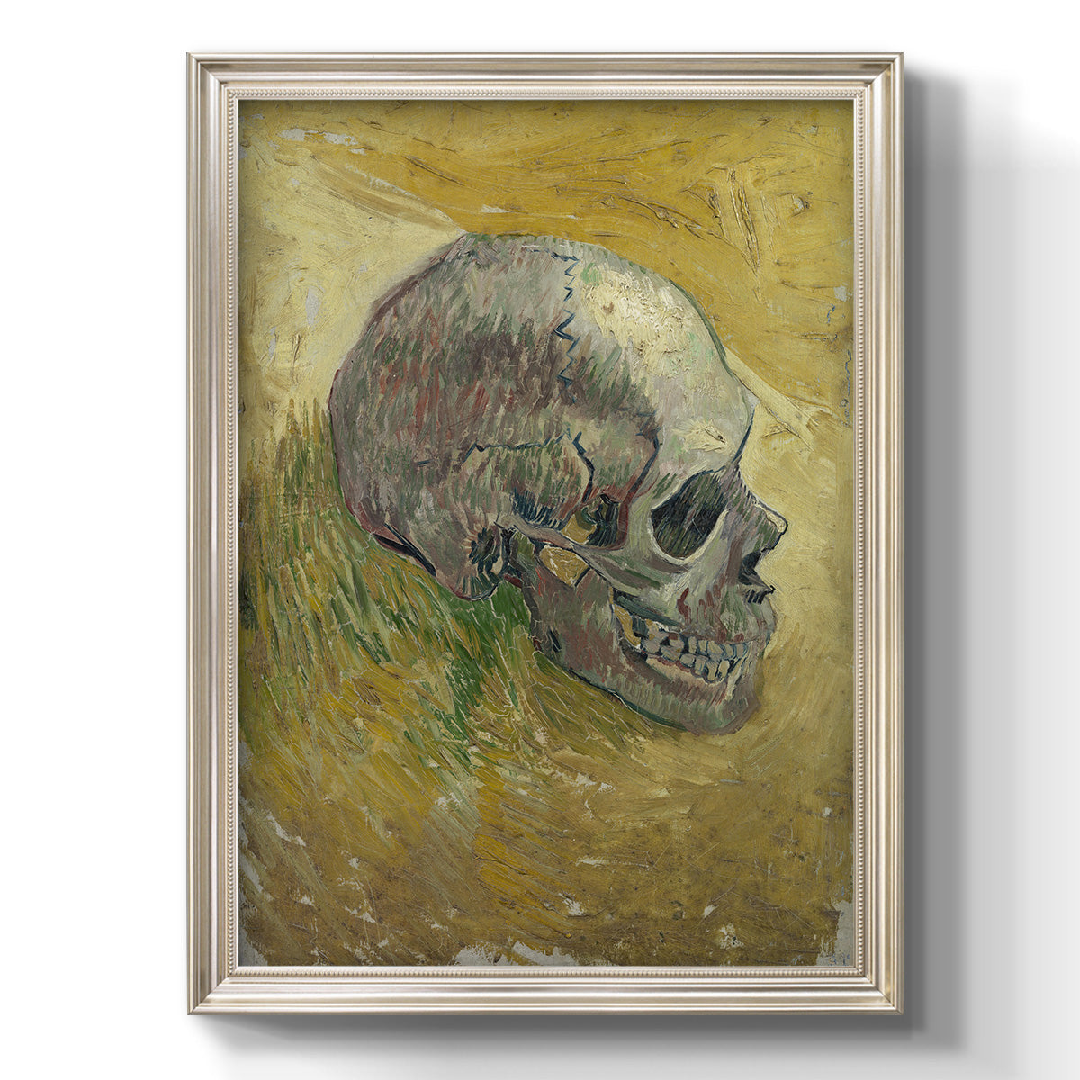 Profile skull study artwork by Vincent van Gogh printed on canvas in an ornate black frame with gilded inner detail with a vertical orientation.