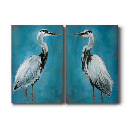 Set of two vertical canvas prints featuring great blue heron coastal bird illustration, displayed side by side.