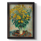 Impressionist floral painting of artichoke flowers by Claude Monet printed on canvas in an ornate black frame with gilded inner detail with a vertical orientation.