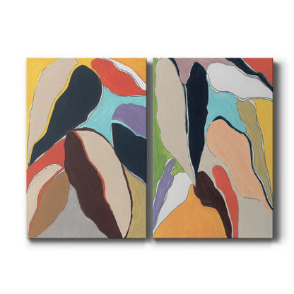 Set of two vertical canvas prints featuring colorful abstract botanical artwork, displayed side by side.