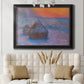 Impressionist haystack scene at sunset by Claude Monet in an ornate black frame with gilded inner detail displayed in a neutral-toned interior setting.
