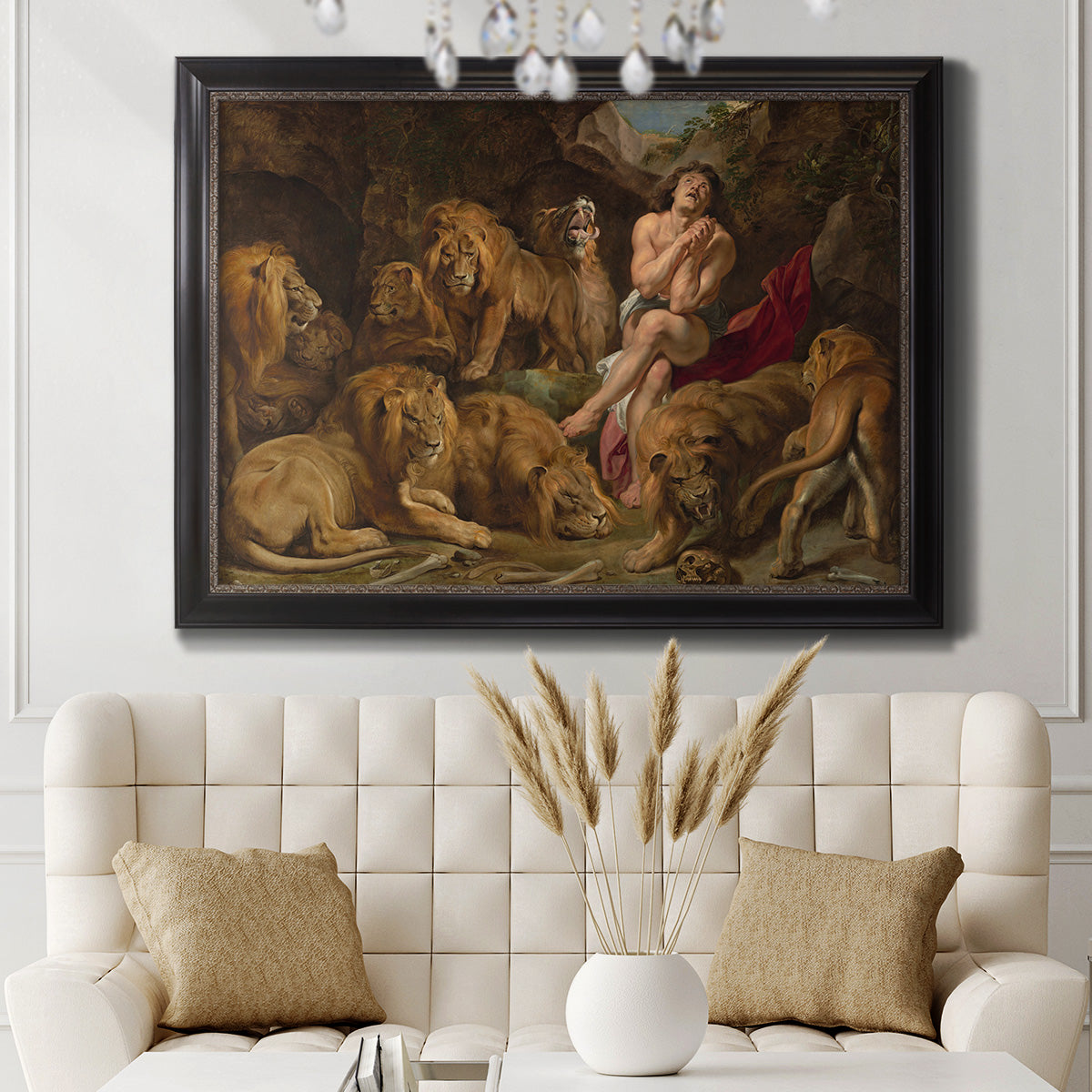Dramatic biblical painting of Daniel with lions by Peter Paul Rubens in an ornate black frame with gilded inner detail displayed in a neutral-toned interior setting.