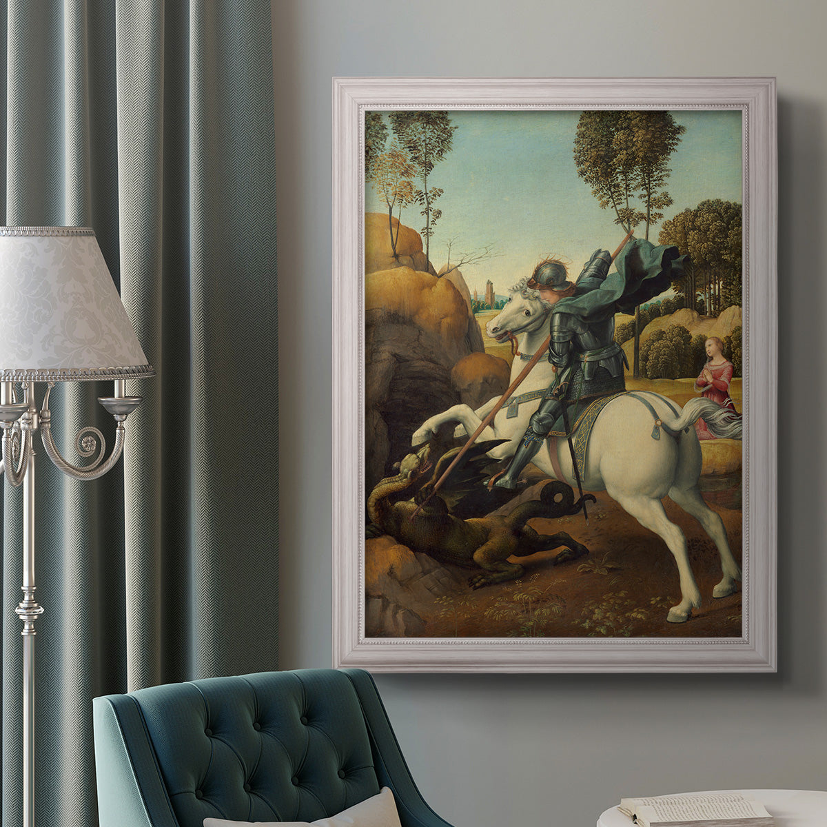Religious painting of Saint George slaying the dragon by Raphael in an ornate weathered white frame displayed in a neutral interior setting.