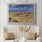 Impressionist wheat harvest scene by Vincent van Gogh in an ornate weathered white frame displayed in a neutral-toned interior setting.