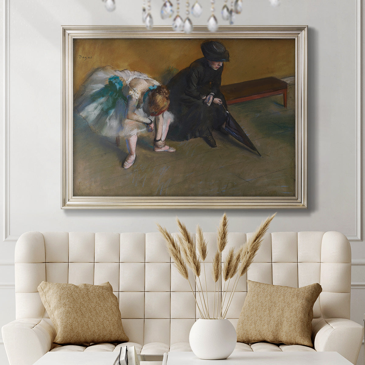 Impressionist portrait of a seated woman by Edgar Degas in an ornate champagne frame displayed in a neutral-toned interior setting.