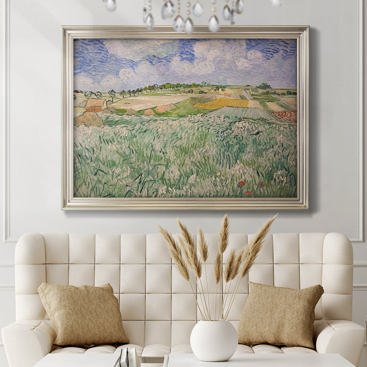 Impressionist countryside landscape near Auvers by Vincent van Gogh in an ornate champagne frame displayed in a neutral-toned interior setting.