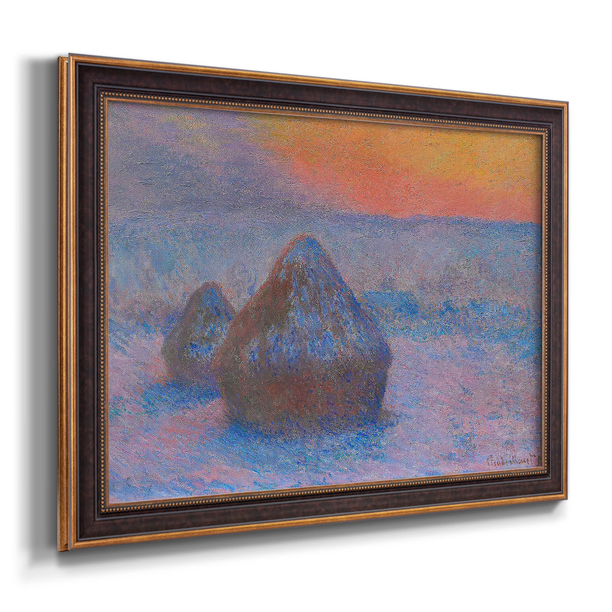 Impressionist haystack scene at sunset by Claude Monet printed on canvas in an ornate bronzed mahogany wood frame.