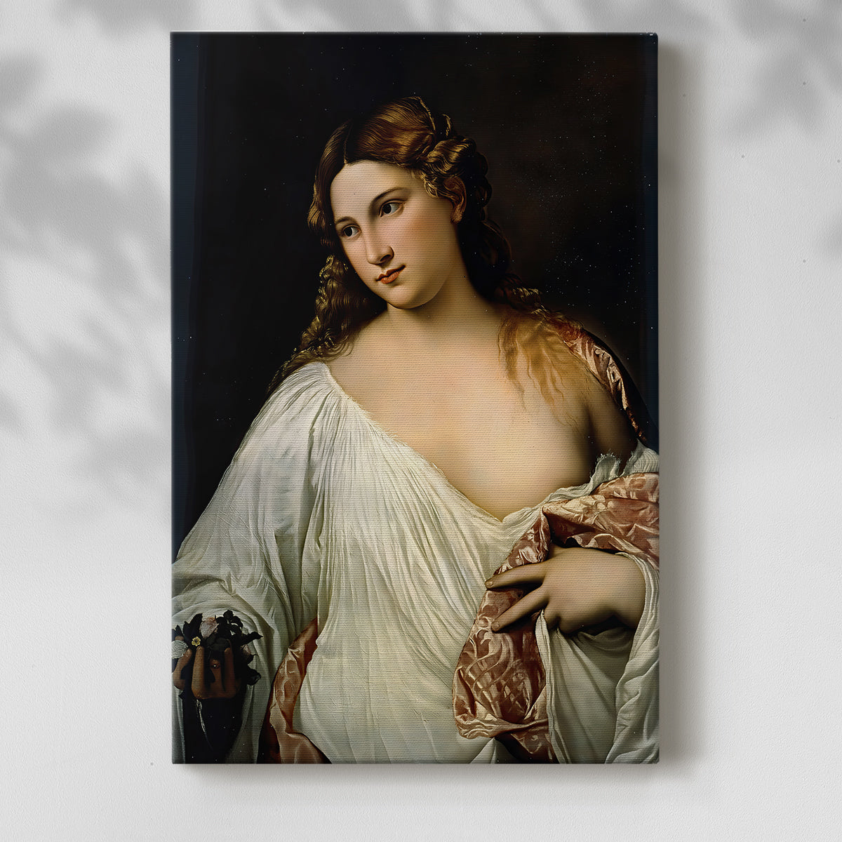Canvas art print of a graceful figure with flowing garments and gentle expression with a soft shadow on a white background.
