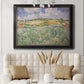 Impressionist countryside landscape near Auvers by Vincent van Gogh in an ornate black frame with gilded inner detail displayed in a neutral-toned interior setting.
