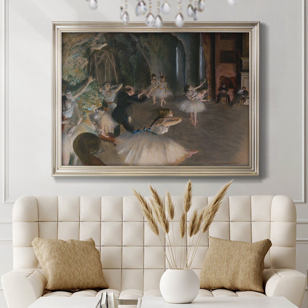 Impressionist backstage ballet scene by Edgar Degas in an ornate champagne frame displayed in a neutral-toned interior setting.