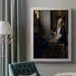 Quiet interior genre scene of a woman with scales by Johannes Vermeer in an ornate weathered white frame displayed in a neutral interior setting.