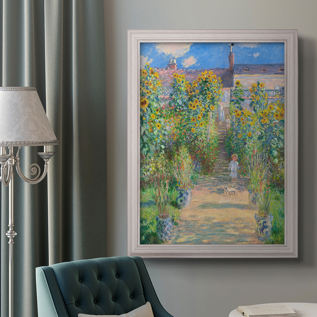 Impressionist garden landscape painting by Claude Monet in an ornate weathered white frame displayed in a neutral interior setting.