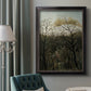 Dreamlike forest landscape scene by Henri Rousseau in an ornate black frame with gilded inner detail displayed in a neutral interior setting.