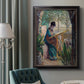 Impressionist portrait of Madame Monet sewing by Claude Monet in an ornate black frame with gilded inner detail displayed in a neutral interior setting.