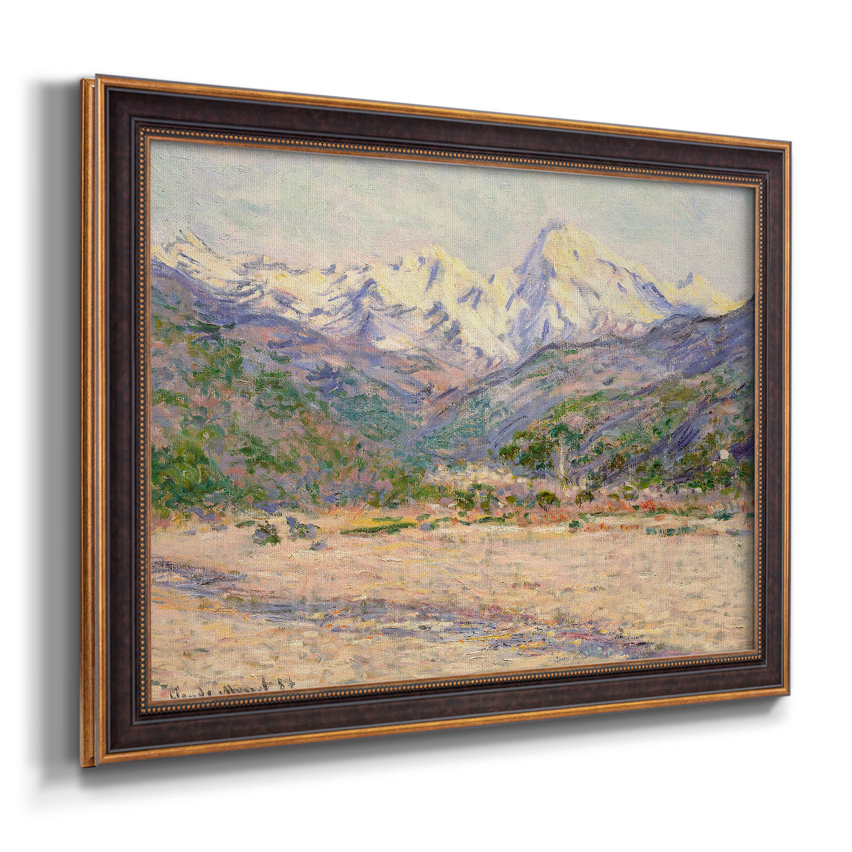 Impressionist valley landscape in southern France by Claude Monet printed on canvas in an ornate bronzed mahogany wood frame.