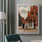 Realist city street scene by Johannes Vermeer in an ornate weathered white frame displayed in a neutral interior setting.