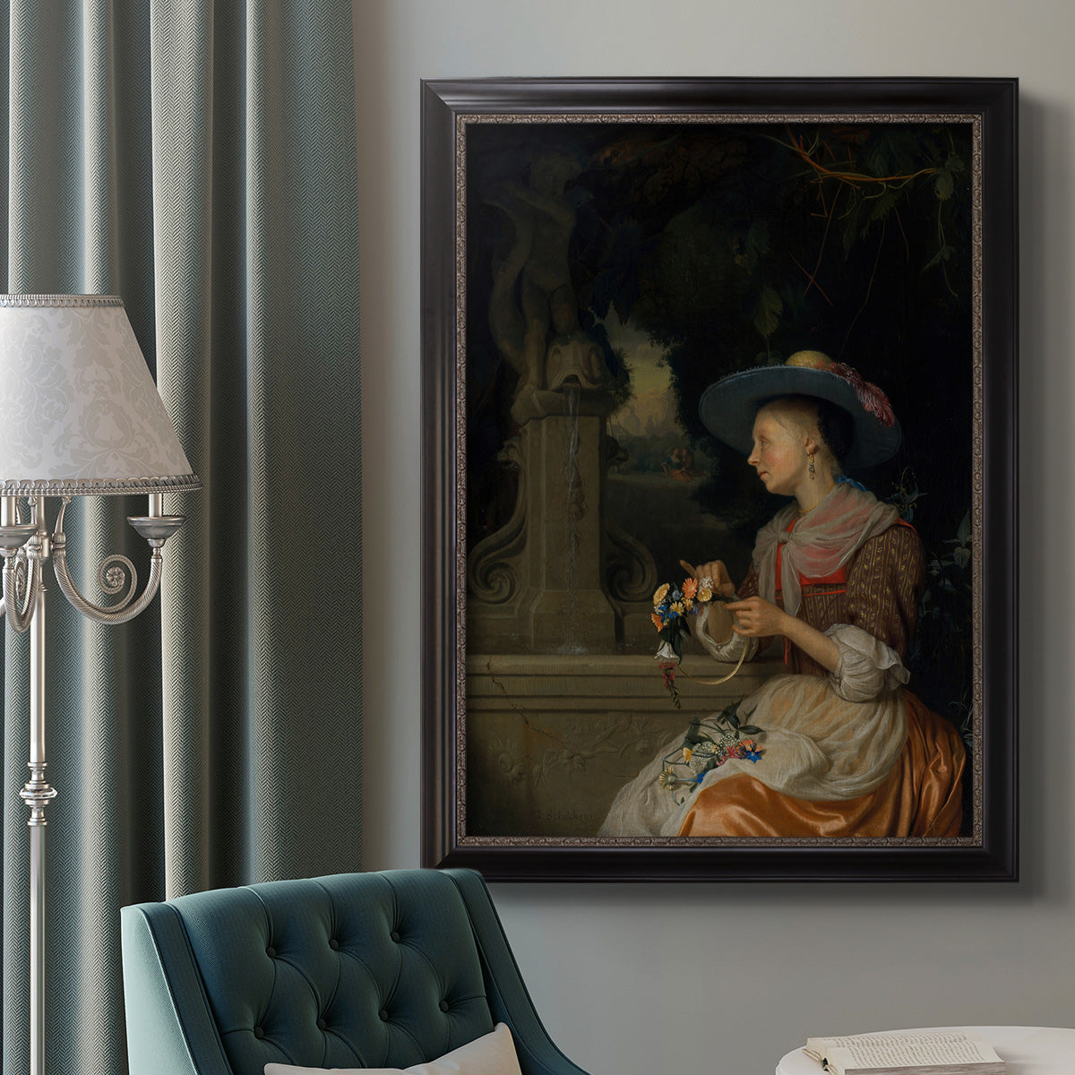 Classical interior scene of a woman weaving flowers by Godfried Schalcken in an ornate black frame with gilded inner detail displayed in a neutral interior setting.