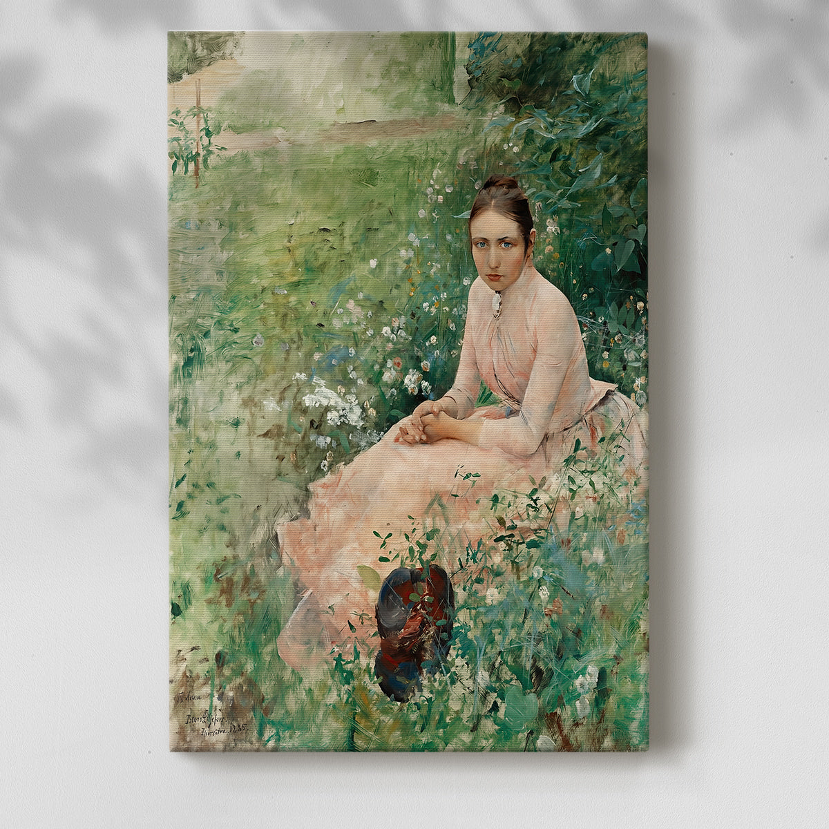 Canvas art print of a figure resting in greenery with soft tones and natural light with a soft shadow on a white background.