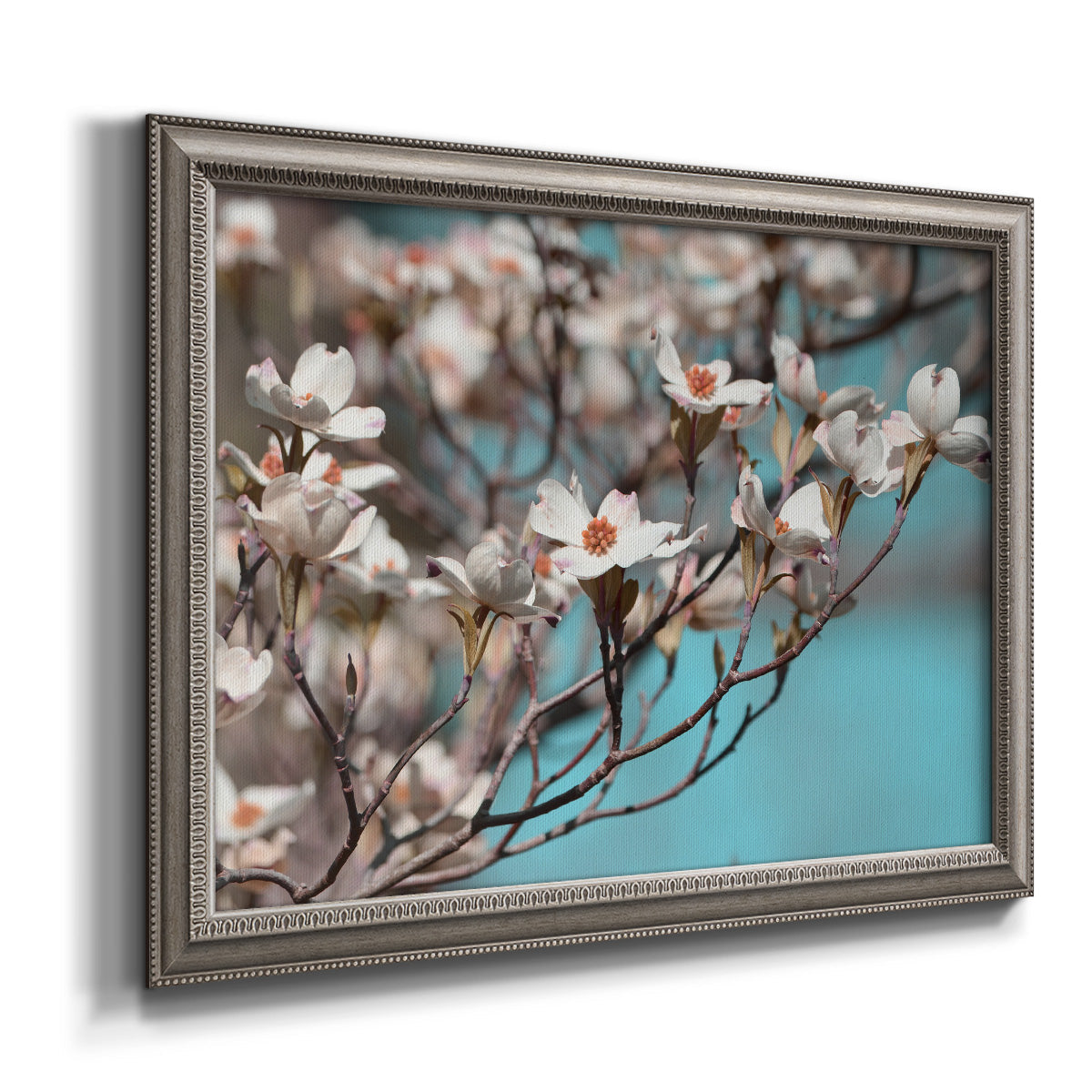 Color-rich dogwood floral photography printed on canvas in an ornate vintage silver frame.