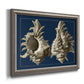 Vintage nautical conch shell artwork on navy background printed on canvas in an ornate vintage silver frame.
