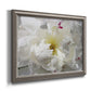 Close up view of peony petals printed on canvas in an ornate vintage silver frame.