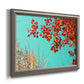 Red autumn leaves against a blue sky printed on canvas in an ornate vintage silver frame.