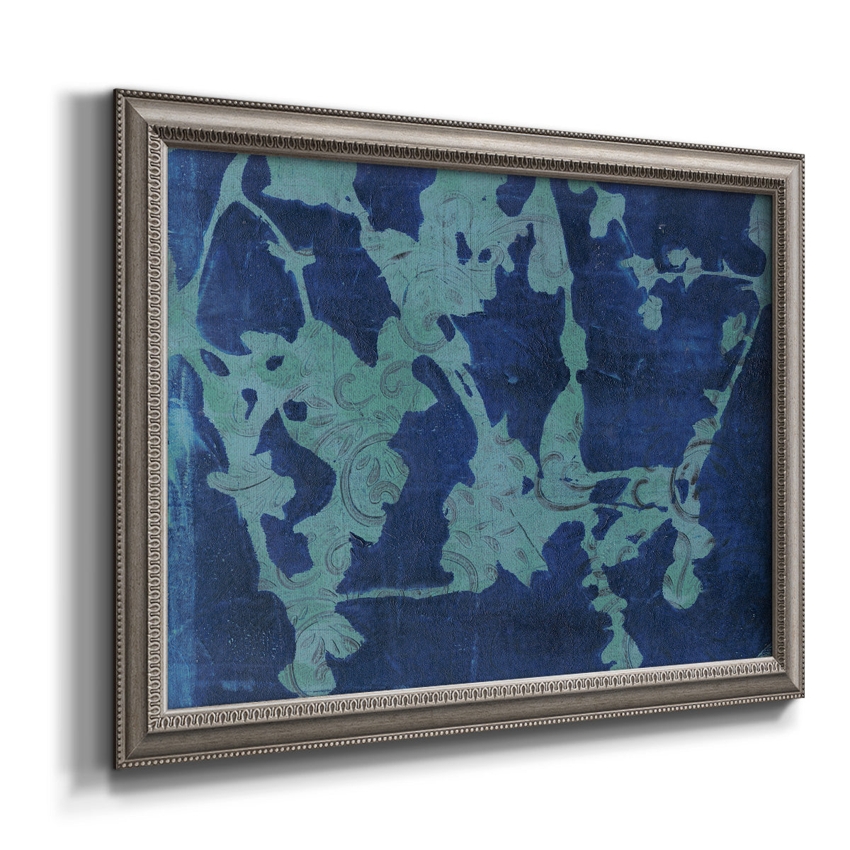 Blue abstract botanical printed on canvas in an ornate vintage silver frame.