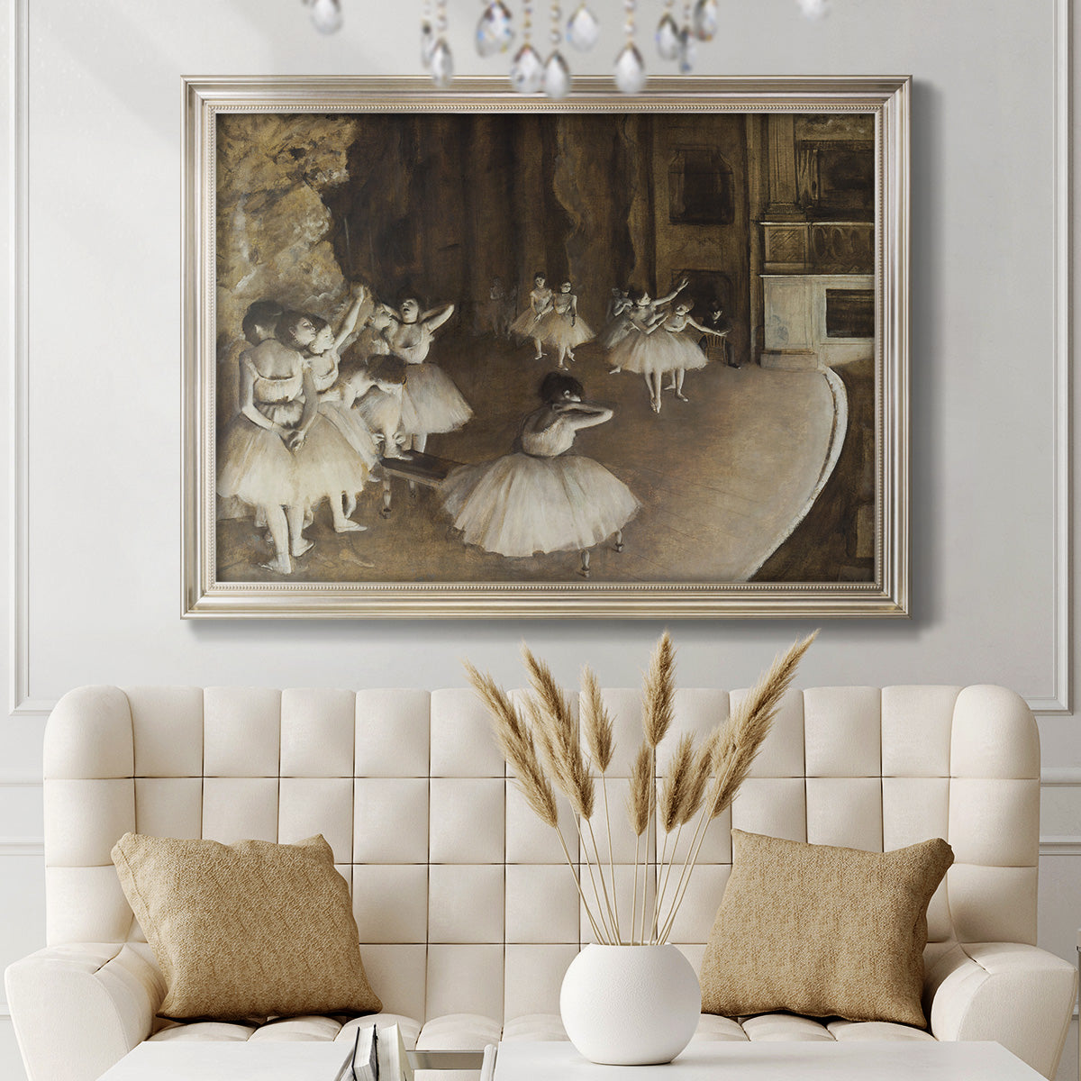 Impressionist ballet rehearsal scene by Edgar Degas in an ornate champagne frame displayed in a neutral-toned interior setting.