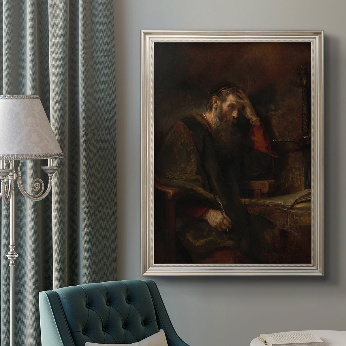 Classical religious portrait of Paul the Apostle by Rembrandt van Rijn in an ornate champagne frame displayed in a neutral interior setting.