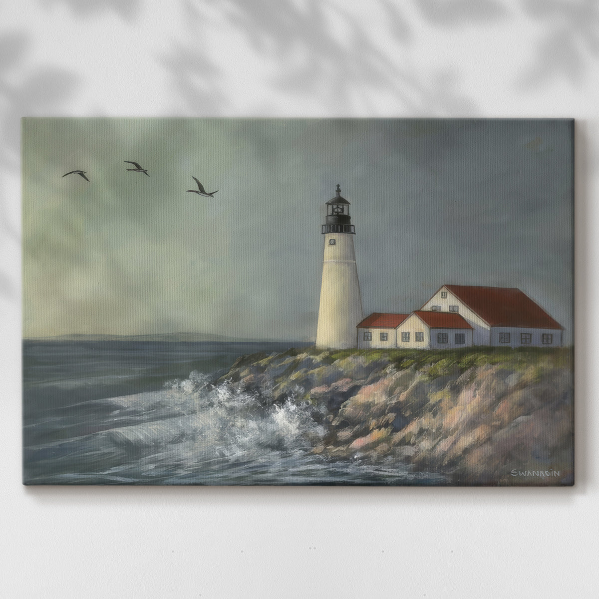 Lighthouse stands tall against crashing waves at a coastal location with birds flying overhead during a calm day