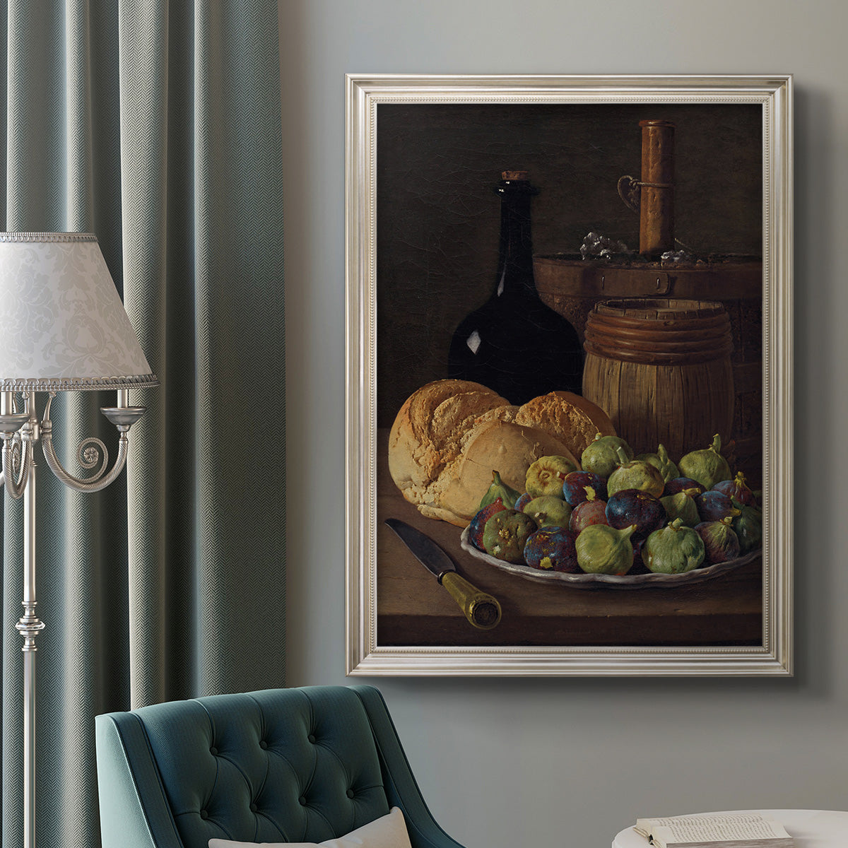 Realist still life with figs and bread by Luis Meléndez in an ornate champagne frame displayed in a neutral interior setting.