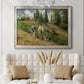 Impressionist countryside harvest scene by Camille Pissarro in an ornate champagne frame displayed in a neutral-toned interior setting.