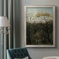 Dreamlike forest landscape scene by Henri Rousseau in an ornate champagne frame displayed in a neutral interior setting.