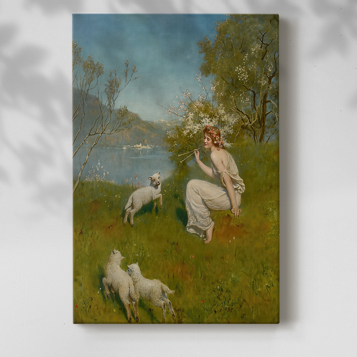 Canvas art print of a female figure and lambs in a forest clearing with greenery and warm tones with a soft shadow on a white background.